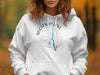White hoodie featuring Kootenai Lake graphic with compass and Canada text.