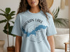 Light blue t-shirt with Ashokan Lake New York map and compass graphic.