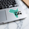 Teal sticker with black text "Stevens Life" on a laptop