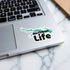 Rathbun Life sticker with a teal map outline and black text on a laptop.