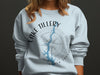 Light blue sweatshirt with Lake Tillery North Carolina map and compass graphic.