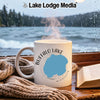 White mug with "Buffalo Lake Minnesota" design sits by a window.