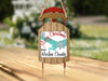 Sled ornament with map of Harlan County and "Merry Christmas" text.