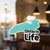 Turquoise outline of Ontario map on glass, text "Ontario Life" and copyright notice.