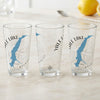 Three clear glasses with blue maps and compass rose designs reading "Yale Lake Washington".