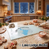 A glass cutting board featuring a map of Lake Buchanan rests on a kitchen counter surrounded by baking supplies.
