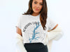 White t-shirt featuring "Jordan Lake North Carolina" text on a compass rose with lake outline.