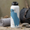 White water bottle with blue map graphic, "LAKE" and "WASH" text, and compass design.