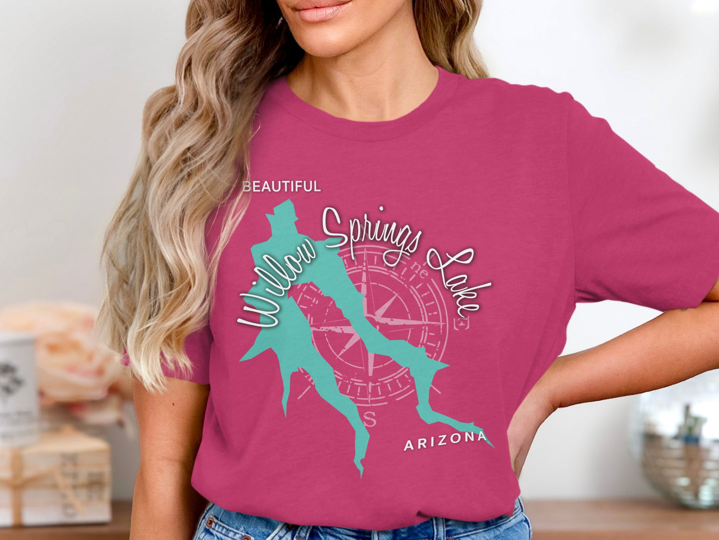 Turquoise Willow Springs Lake logo on pink t-shirt.