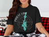 Black t-shirt with Priest Lake Idaho map graphic and compass design.