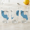 Three clear glasses feature a blue Sandhill Lake map outline and compass rose.