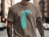 Brown t-shirt with teal Lake Michigan graphic and compass design with text.