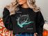 Black sweatshirt with "Beautiful Lake Seminole Georgia" and a compass rose.