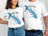 White t-shirts with Wauka Lake map graphic printed on them.