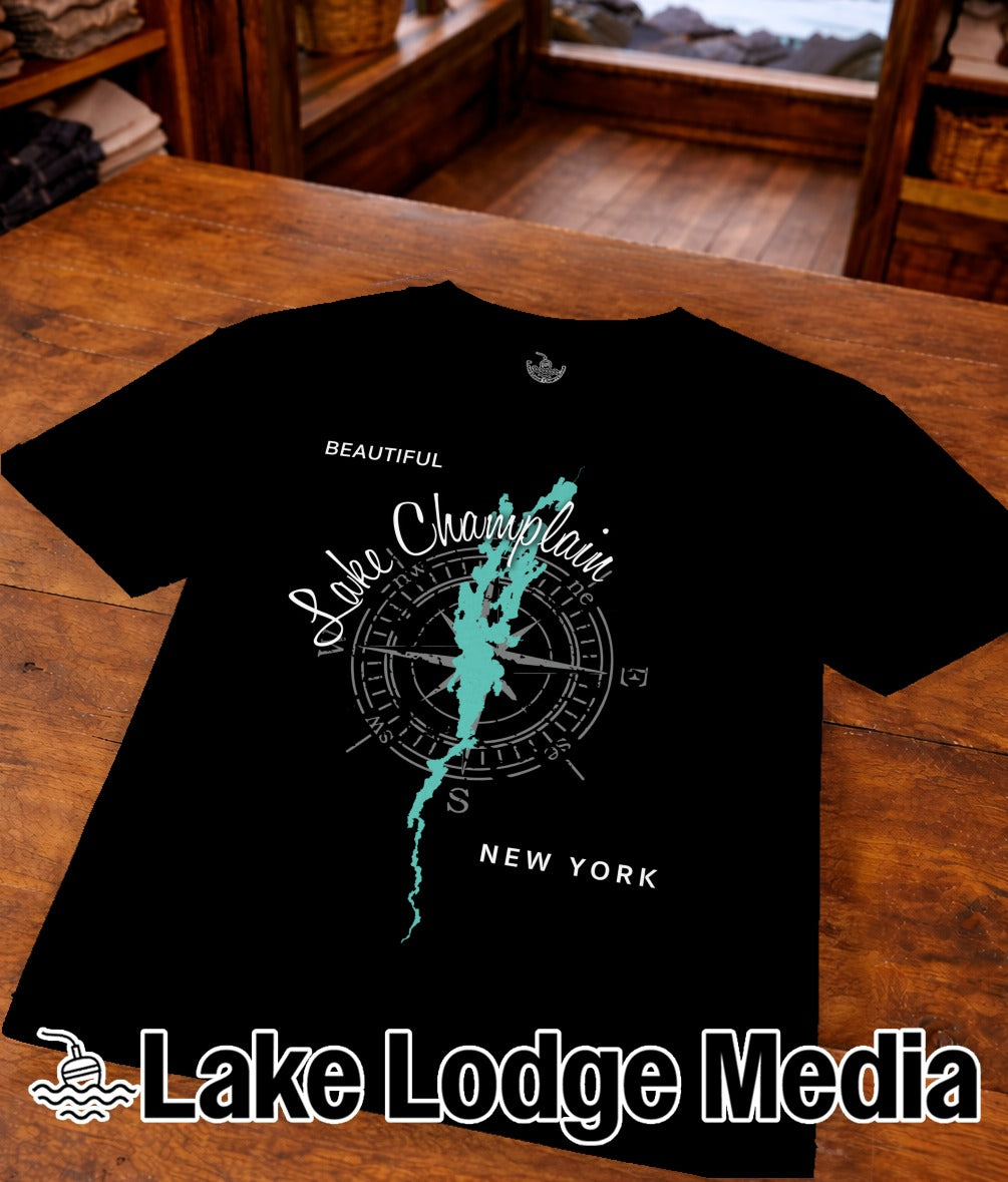 Black t-shirt with "Beautiful Lake Champlain" text and compass graphic.