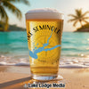 Glass of beer with "Lake Seminole" and Georgia map design on a beach.