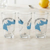 Three clear glasses featuring a blue map of Merrymeeting Lake and compass graphic.