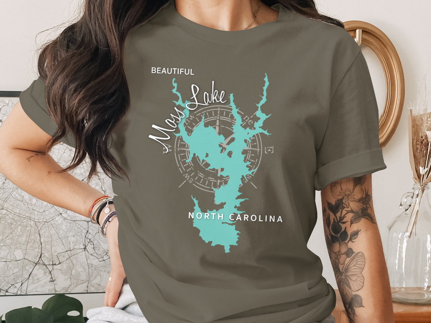 T-shirt with a teal map of Lake Norman, North Carolina and compass rose.
