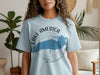 Light blue t-shirt with "LAKE AMERICA" and map over compass graphic.