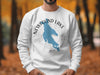 White sweatshirt with blue Newfound Lake map graphic and compass graphic.