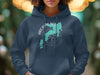 Dark blue hoodie with a teal map graphic and compass rose labeled Arcadia Lake, Oklahoma.