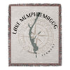 Woven blanket with Lake Memphremagog map and compass design.