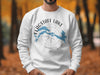 White sweatshirt with Flagstaff Lake Maine map and compass design.