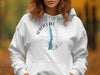 White hoodie with "Torch Lake Michigan" text and a compass rose graphic.