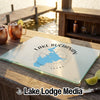 A glass cutting board featuring a map of Lake Buchanan, Texas, sits on a wooden dock.
