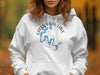White hoodie with Green River Lake Kentucky map and compass graphic.