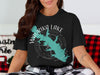 Black t-shirt with turquoise map design of Waurika Lake, Oklahoma and compass rose.