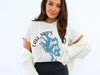 White t-shirt with "Lake Tapps Washington" text and blue water map graphic.