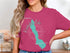 Pink t-shirt with turquoise outline map of Keekelus Lake and compass.