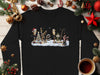 Christmas fishing scene with bears, snow, and festive lights on a black sweatshirt.