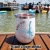A white tumbler with Lake Lure North Carolina text stands on a wooden boat dock.