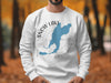 White sweatshirt with blue Snow Lake map and compass design.