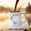 White mug with "Lake Oroville California" map and compass design, coffee splashing.