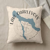 Cream pillow with blue Lake Charlevoix map and compass graphic.