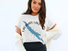White t-shirt with Lacamas Lake map and compass design, Washington.