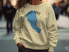 Light yellow sweatshirt with Pyramind Lake, Nevada map and compass design.