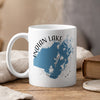 White mug with blue Indian Lake Ohio map and compass design.