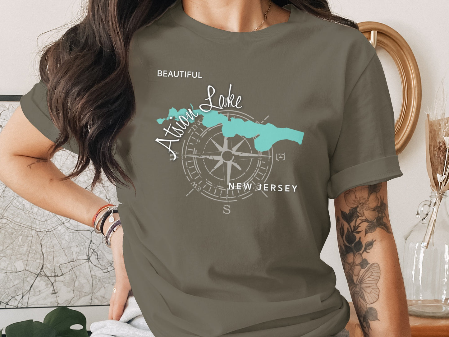 Green t-shirt with a compass rose and "Atlantic Lake New Jersey" map graphic.