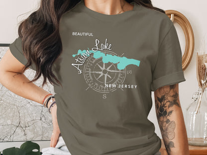 Green t-shirt with a compass rose and "Atlantic Lake New Jersey" map graphic.