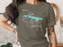 Green t-shirt with a compass rose and "Atlantic Lake New Jersey" map graphic.