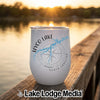 White travel tumbler featuring a blue map of Hyco Lake, North Carolina, over a compass design, sitting on a wooden dock at sunset.