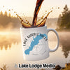 White mug with "Lake Marble Falls Texas" and compass design, coffee pouring.