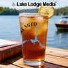 Glass of iced tea with Lake Mead map, compass, and lemon slice.