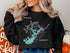 Black sweatshirt with "Beautiful Lake Lanier Georgia" and compass rose map graphic.
