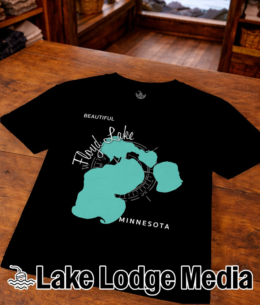Black t-shirt with teal map outline of Lake Flond and "Lake Lodge Media" text.