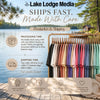 Rack of colorful t-shirts with Lake Lodge Media processing and shipping information.